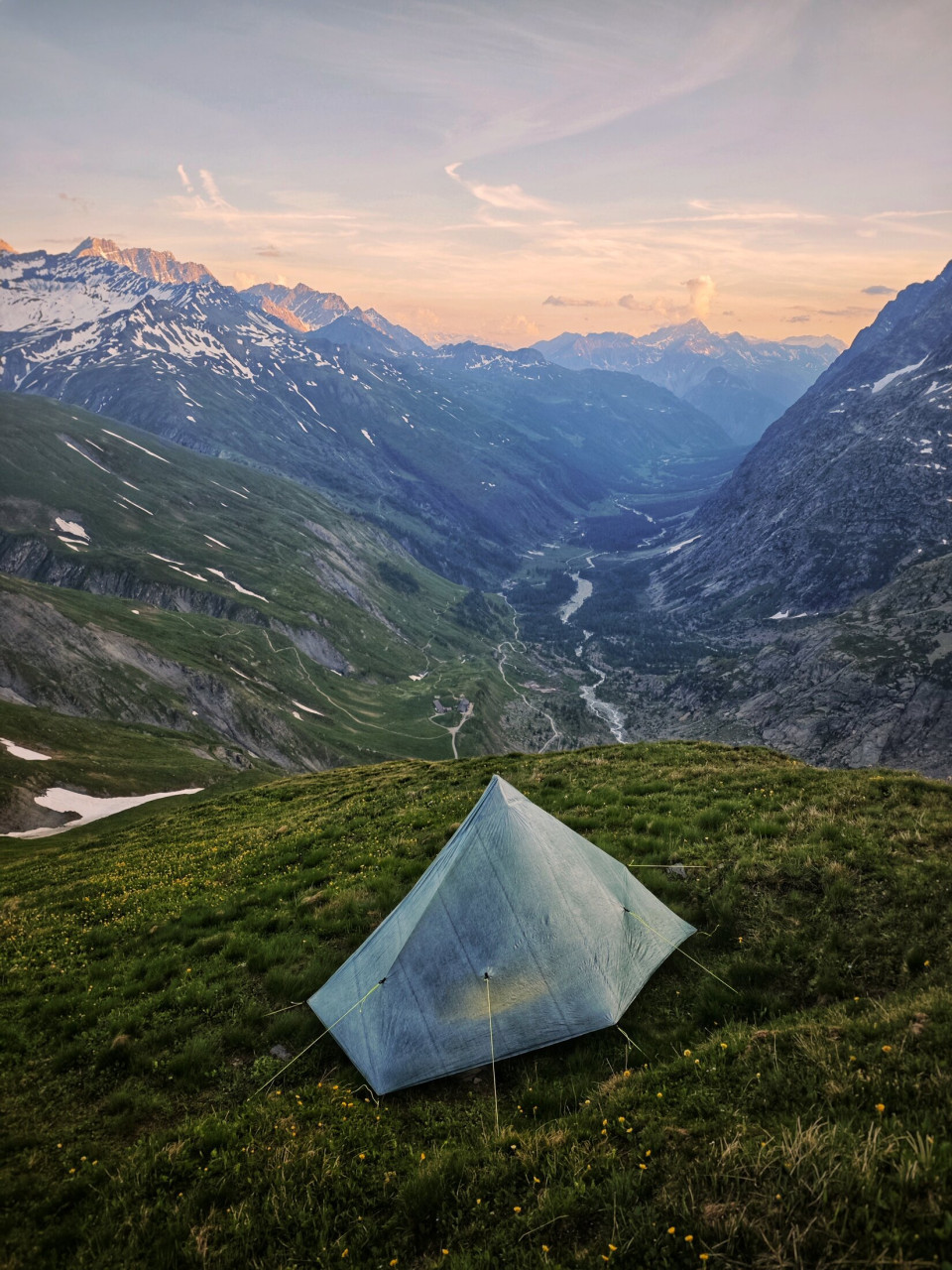 Tent bivouac at dusk on the Tour du Mont-Blanc in early June