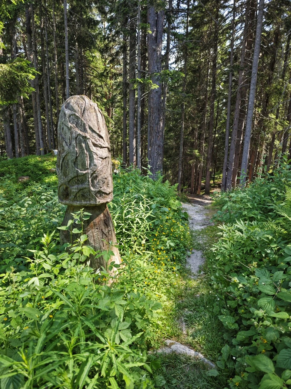 Wooden sculpture on the forest trail at Champex