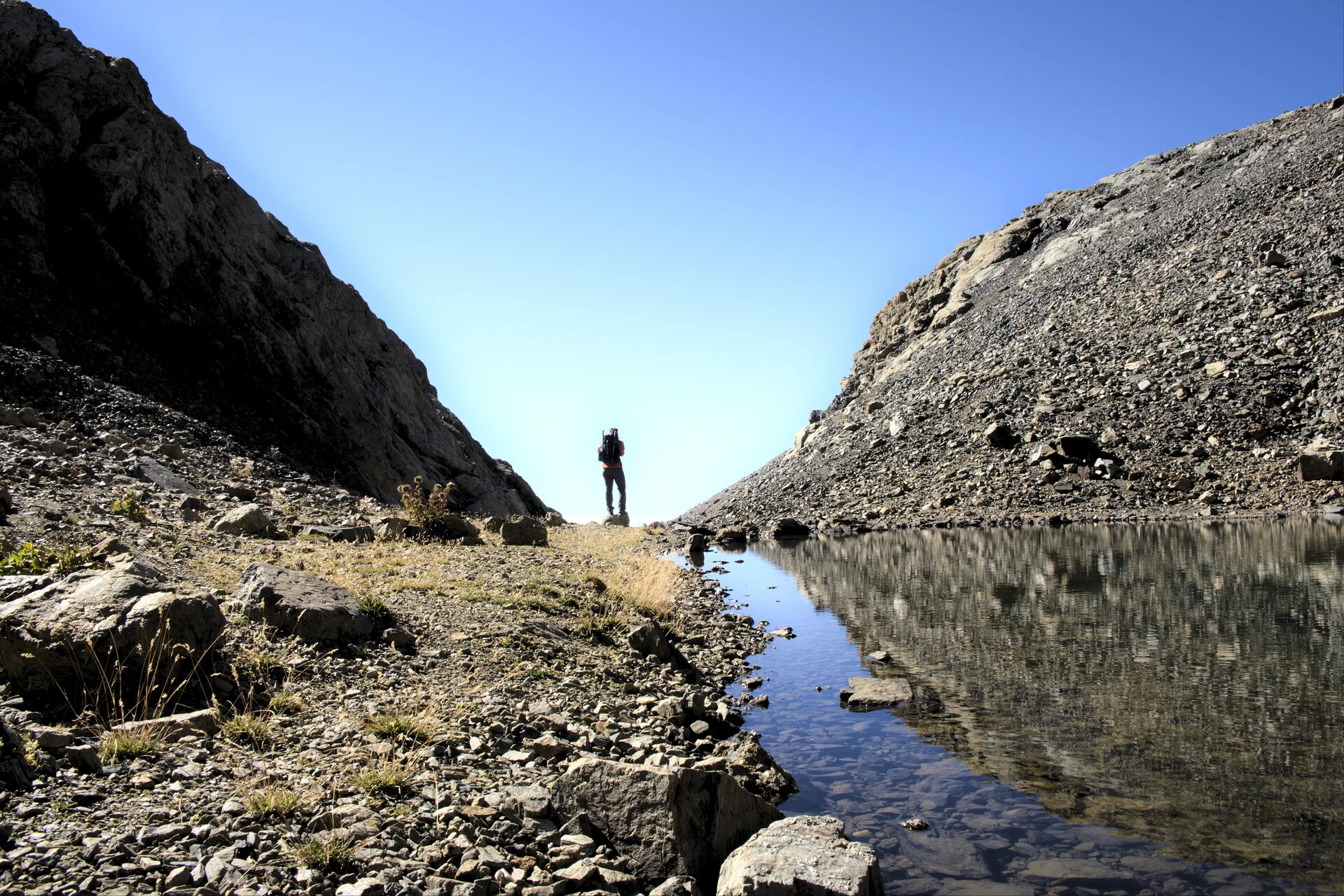 Small mountain lake below the Vieux Chaillol ridges